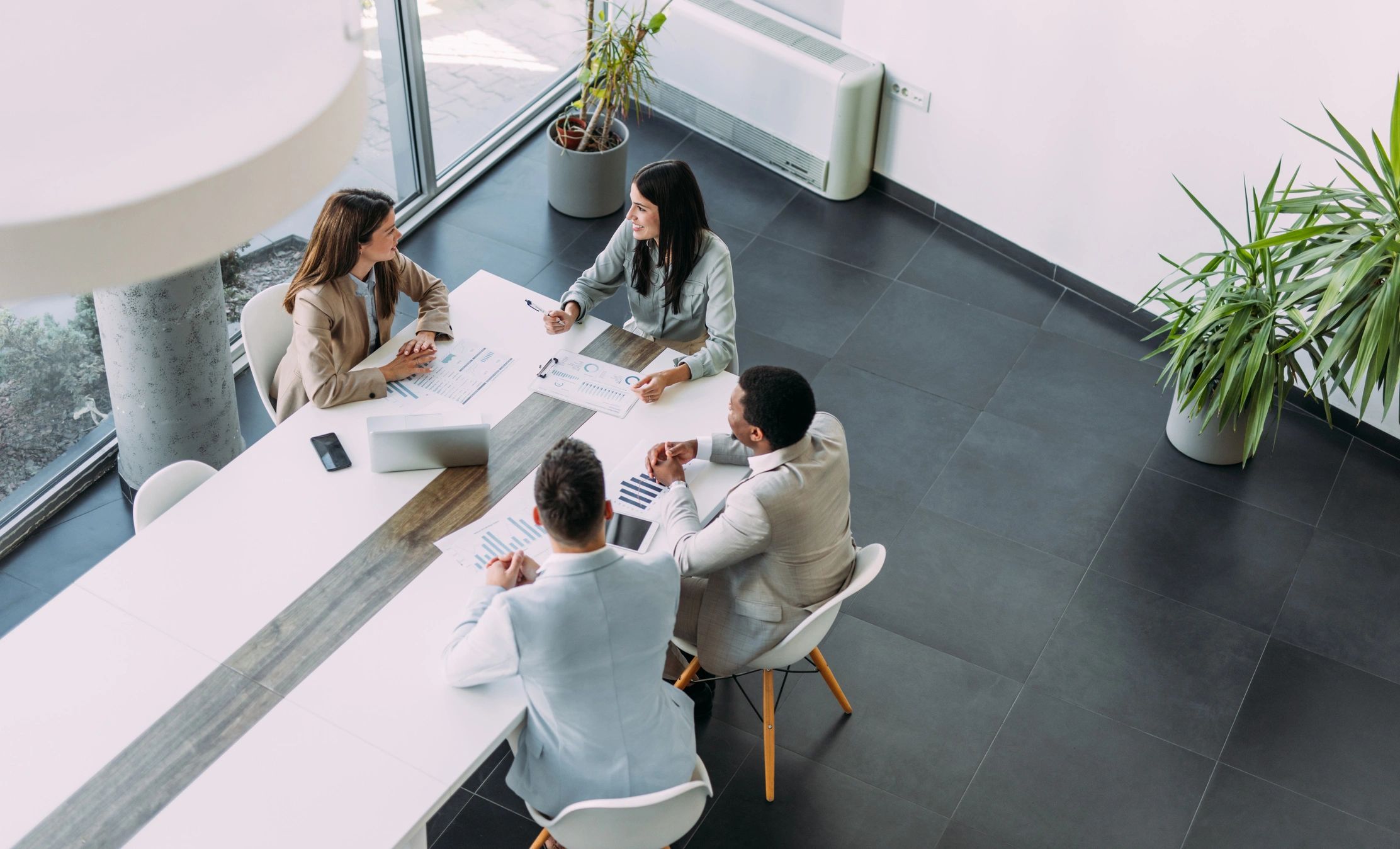Professional advisory meeting around a boardroom table